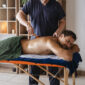 side view man getting professional massage 85x85